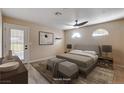 Cozy bedroom with modern ceiling fan, stylish accents, and natural light at 6117 Foxcroft Ave, Las Vegas, NV 89108