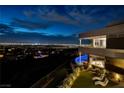 Contemporary home featuring a lush backyard, private pool, and breathtaking city views at 621 Majestic Rim Dr, Henderson, NV 89012