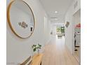 Bright hallway featuring recessed lighting, a decorative mirror, and neutral walls creating an open flow at 6270 Lamont Hills Ave, Las Vegas, NV 89139