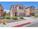 Charming two-story home featuring a two-car garage, manicured landscaping, and a fire hydrant at 6379 Dundock Ave, Las Vegas, NV 89122