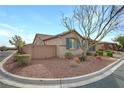 Side view of a charming single-story home with a well-maintained yard and privacy wall at 6814 Willowcroft St, Las Vegas, NV 89149