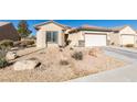 Charming single story home with a two car garage and low maintenance landscaping at 7649 Broadwing Dr, North Las Vegas, NV 89084