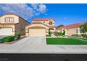 Two-story home with red tile roof, two car garage and well maintained lawn at 7916 Nesting Pine Pl, Las Vegas, NV 89143