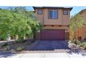 Charming two-story home with brick paved driveway and desert landscaping for low maintenance appeal at 8324 S Miller Ln, Las Vegas, NV 89113