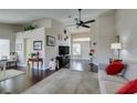 Inviting living room with vaulted ceiling, hardwood floors, and neutral paint for a cozy atmosphere at 8808 Litchfield Ave, Las Vegas, NV 89134
