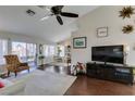 Bright living room featuring dark wood floors, neutral paint, high ceilings, and natural light at 8808 Litchfield Ave, Las Vegas, NV 89134