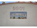 Close-up of the Deerfield community sign displaying the address, 9901, set against a textured wall at 9901 Trailwood Dr # 2109, Las Vegas, NV 89134