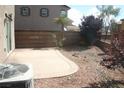 Private backyard featuring a patio, desert landscaping, and block wall at 1158 Gecko Rd, Henderson, NV 89002