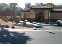 Welcoming entrance to the building with tile roof and desert landscaping at 1158 Gecko Rd, Henderson, NV 89002