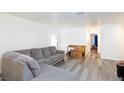 Comfortable living room featuring a large sofa and views into other rooms at 1509 Linnbaker Ln # 203, Las Vegas, NV 89110