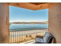 Breathtaking lake view from a private balcony with comfortable seating, perfect for relaxing at 20 Via Mantova # 306, Henderson, NV 89011