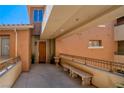 Inviting front entrance with stylish seating and manicured landscaping at 20 Via Mantova # 306, Henderson, NV 89011