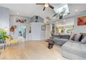 Spacious living room with vaulted ceilings, skylight, and wood-look flooring at 224 Silver Castle St, Las Vegas, NV 89144