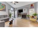 Cozy living room with a fireplace, a sliding glass door, and modern decor at 224 Silver Castle St, Las Vegas, NV 89144