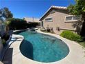 Private backyard pool and spa offer a relaxing oasis with lush landscaping and ample patio space at 224 Silver Castle St, Las Vegas, NV 89144