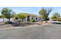 Charming single-story home with stucco exterior, arched windows, and desert landscaping at 2500 S Zephyr Ave, Pahrump, NV 89048