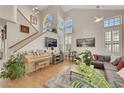 Cozy living room with vaulted ceilings, a piano, and abundant natural light at 2909 Sterling Cove Dr, Las Vegas, NV 89128