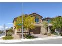 Attractive two-story home with low maintenance landscaping and a two-car garage on a sunny day at 2951 Overlook Brook St, Las Vegas, NV 89156
