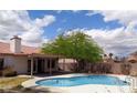 Inviting backyard pool area with a covered patio, perfect for outdoor relaxation and entertainment at 3024 Nutwood St, Las Vegas, NV 89108