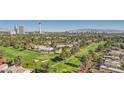Stunning aerial view overlooking a lush green golf course and the Las Vegas skyline at 3111 Bel Air Dr # 18B, Las Vegas, NV 89109