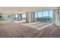 Bright living room with floor to ceiling windows and sliding doors to balcony at 3111 Bel Air Dr # 18B, Las Vegas, NV 89109