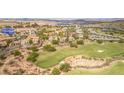 Aerial view of a home near a golf course and lake in a Primary-planned community at 32 Cerchio Basso, Henderson, NV 89011