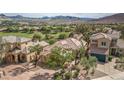 This beautiful property is located near a golf course and features mature landscaping, adding to its curb appeal at 32 Cerchio Basso, Henderson, NV 89011