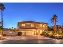 Two-story home with a three-car garage, mature palm trees, and a charming front porch with stone accents at 4471 Borrego Springs Way, Las Vegas, NV 89129