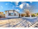 Beautifully remodeled single-story home with a fresh exterior, updated windows, and large driveway at 4471 Wisconsin Ave, Las Vegas, NV 89104