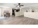 Open concept living space featuring luxury vinyl plank flooring and a view of the kitchen at 4846 Lone Grove Dr, Las Vegas, NV 89139