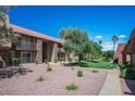 Condominium exterior featuring well-maintained landscape with walking paths at 4980 Indian River Dr # 447, Las Vegas, NV 89103