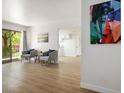 Bright living room featuring wood floors, a balcony and modern furnishings at 4980 Indian River Dr # 447, Las Vegas, NV 89103