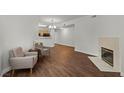 View of the open living room with a fireplace and wood flooring at 5250 S Rainbow Blvd # 1029, Las Vegas, NV 89118