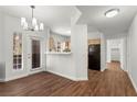 Spacious living room with wood flooring, dining area, and kitchen access at 5250 S Rainbow Blvd # 1029, Las Vegas, NV 89118