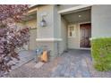 Welcoming entryway featuring a brick walkway, covered porch, and stylish front door, creating a warm first impression at 5269 Silver Branch Ave, Las Vegas, NV 89118