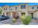 Charming townhome boasting a landscaped front yard, brick driveway, and convenient parking, adding to its desirability at 5269 Silver Branch Ave, Las Vegas, NV 89118