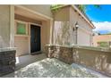 Front door and porch with stone accents at 5631 Hill Cliff Ct, North Las Vegas, NV 89031