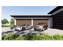 Modern multi-car garage featuring sleek doors and ample parking space at 5855 St Ebbes Ct, Las Vegas, NV 89131