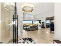 Bright, expansive living room featuring floor to ceiling windows and modern furnishings at 6194 Stone Rise St, Las Vegas, NV 89135