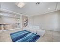 Bright living room with tile flooring, modern lighting and lots of space at 6205 Windy Oaks Ct, Las Vegas, NV 89139