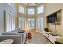 Bright living area with large windows, neutral tones, and stylish modern decor at 7217 Mission Hills Dr, Las Vegas, NV 89113