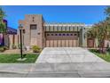 Lovely single-story home featuring an attached garage and well-kept front yard at 130 Twin Towers Ave, Las Vegas, NV 89123