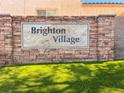 Stone entrance sign for Brighton Village neighborhood at 1316 Oak Village Ave, Las Vegas, NV 89183
