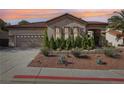 Charming single-story home with a tile roof, desert landscaping, three-car garage, and well-maintained lawn at 1343 Panini Dr, Henderson, NV 89052