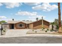 Charming single-story home with a well-maintained front yard and mature landscaping at 204 Breeze St, Las Vegas, NV 89145