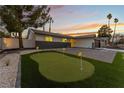 Charming single-story home showcasing a putting green and well-manicured landscaping at 2909 Gilmary Ave, Las Vegas, NV 89102