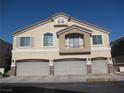 Charming home featuring a three-car garage, upper balcony, and a neutral stucco exterior at 3208 Regal Swan Pl # 3, North Las Vegas, NV 89084