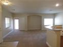 Spacious living room with carpet flooring, neutral paint, and abundant natural light at 3208 Regal Swan Pl # 3, North Las Vegas, NV 89084