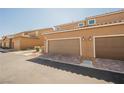 Attached two-car garage with brick driveway in a modern townhome community at 3270 Trabia Ave, Henderson, NV 89044