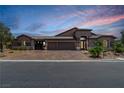 Inviting one-story home featuring a three-car garage and a beautifully paved driveway at 3906 Jacob Lake Cir, Las Vegas, NV 89118